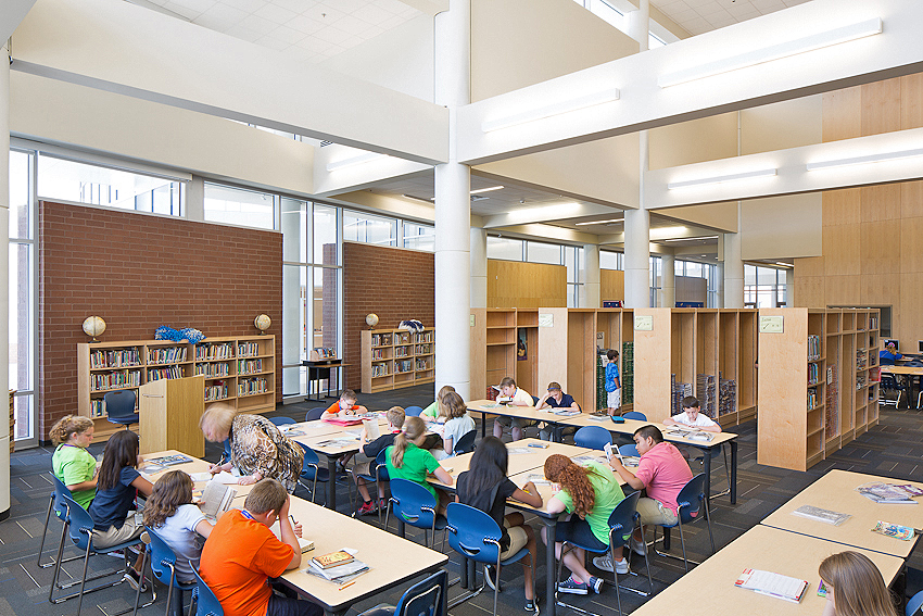 View of students in the library at Sylvan Hills Middle School designed by WDD Architects.
