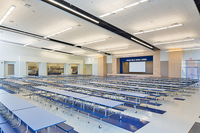 Sylvan Hills Middle School Interior view of the cafeteria and performance stage at Sylvan Hills Middle School designed by WDD Architects.