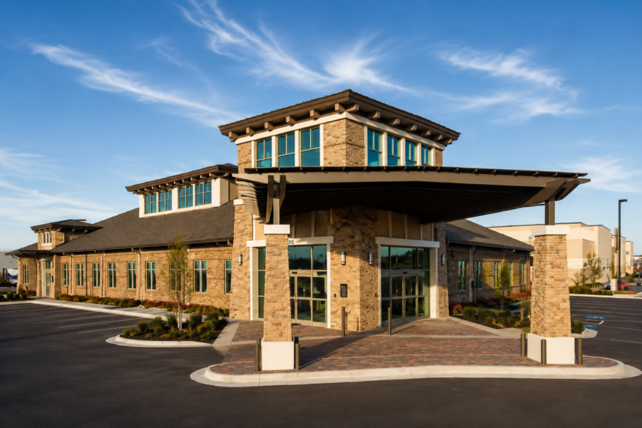 Mellon Clinic exterior in Fayetteville, Arkansas, featuring a covered entrance, clerestory windows and brick and stone facade