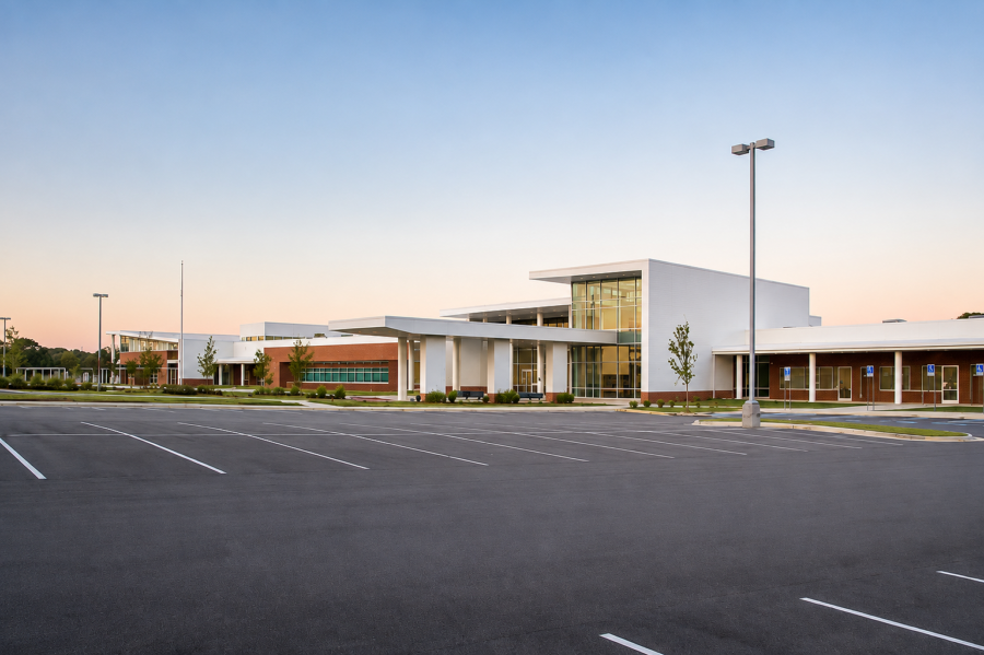 Wide exterior view of Sylvan Hills Middle School in Little Rock, Arkansas, featuring the main entrance and modern brick and glass facade.