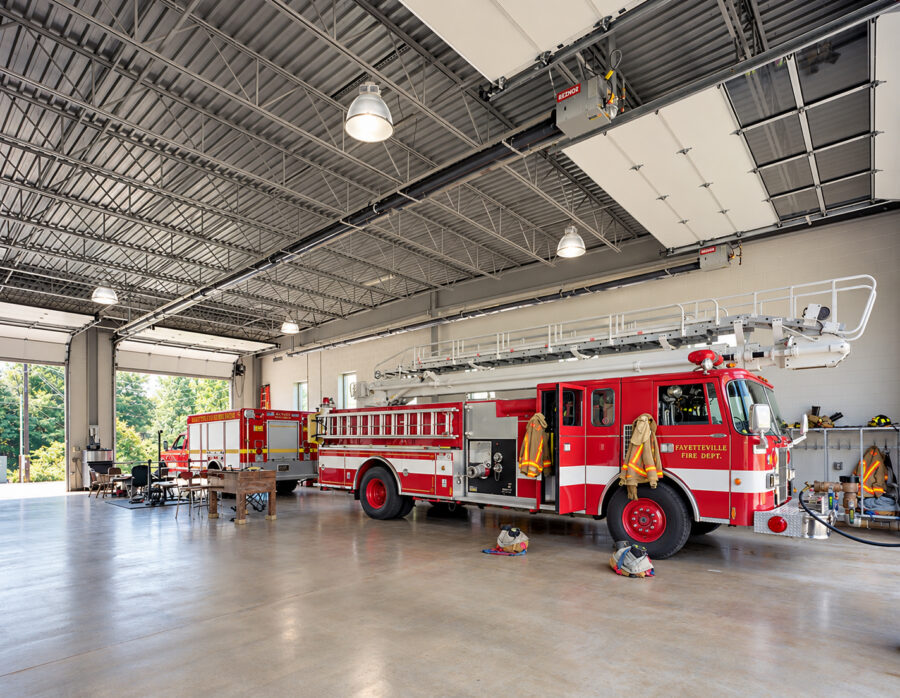 Garage bay at Fayetteville Fire Station #4 in Arkansas with Fayetteville Fire Department vehicles.