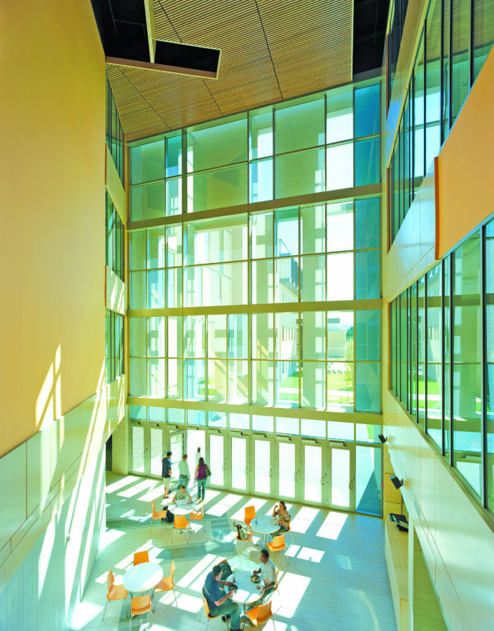 Interior lobby view with large decorative glass walls at the JB Hunt Transport Services Center in Fayetteville, AR.