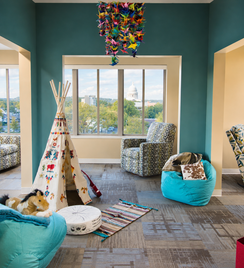 Children’s play and sitting area at Ronald McDonald House with views of the Arkansas State Capitol