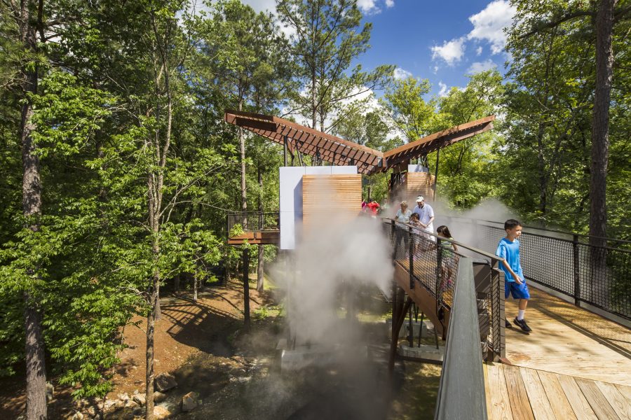 Visitors walking through fog along the Science Skywalk at Mid America Museum