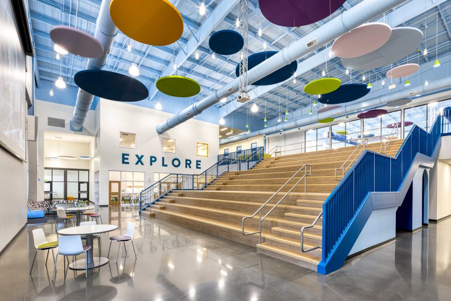 Jim Rollins Elementary School of Innovation learning commons with tiered seating and flexible student gathering spaces.