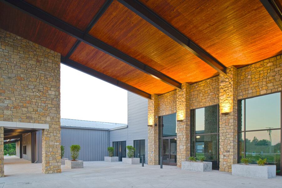 Close-up view of wood canopy entrance at Fellowship Bible Church in Cabot, AR