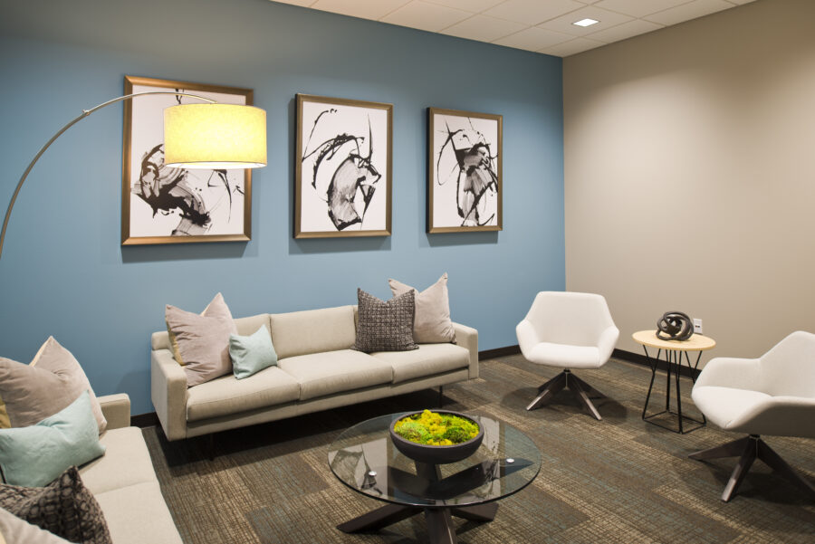 Interior seating area at Fellowship Bible Church in Cabot, Arkansas, featuring modern furnishings and a blue accent wall.