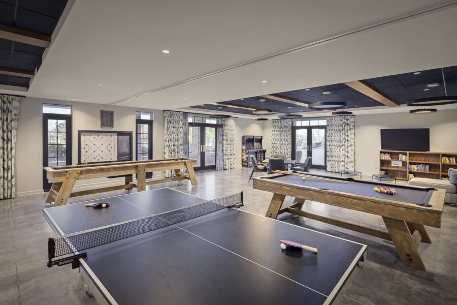 Game room at the Country Club of Little Rock Commons Addition featuring ping pong, shuffleboard and billiards tables.
